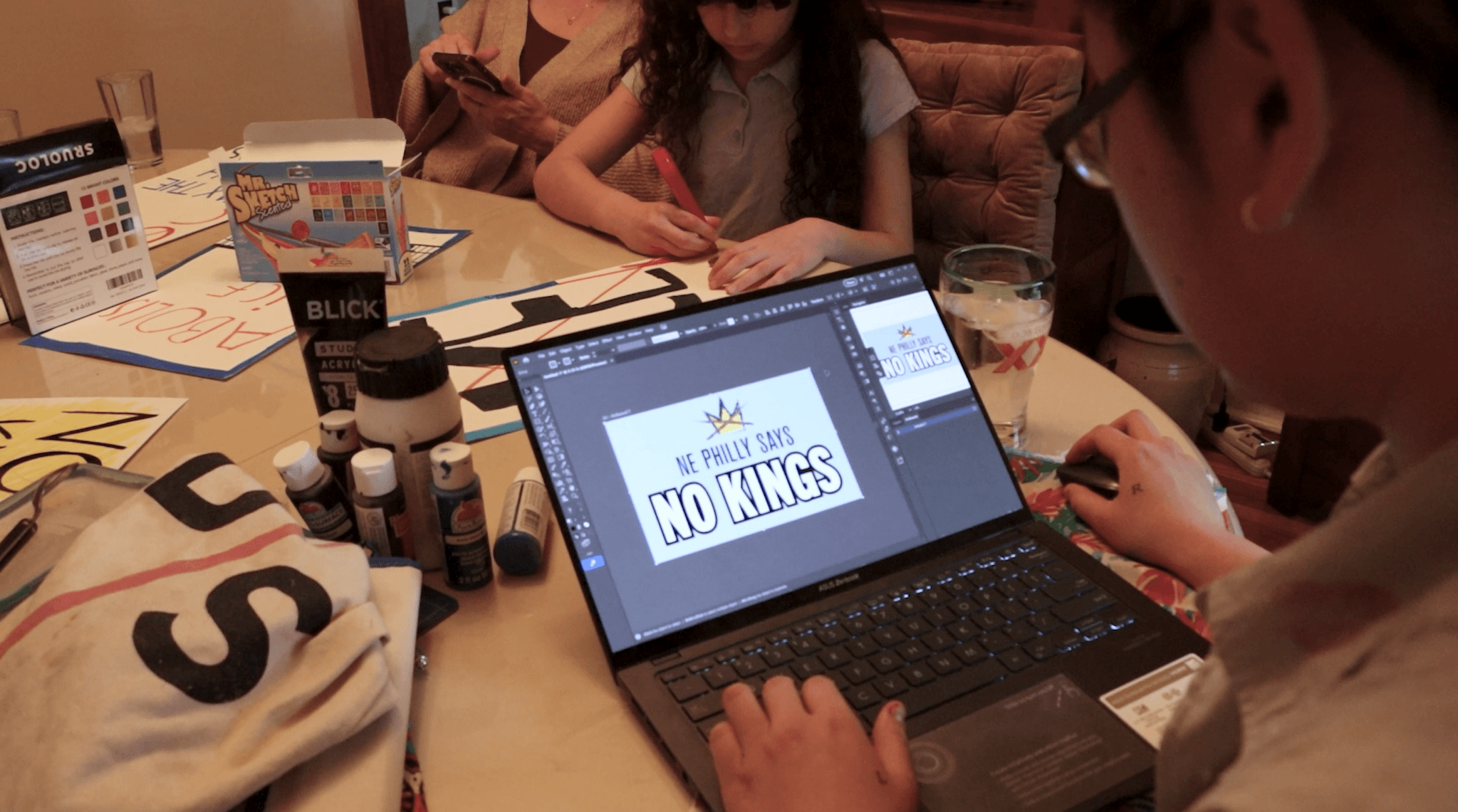 Participants making signs and campaign graphics together